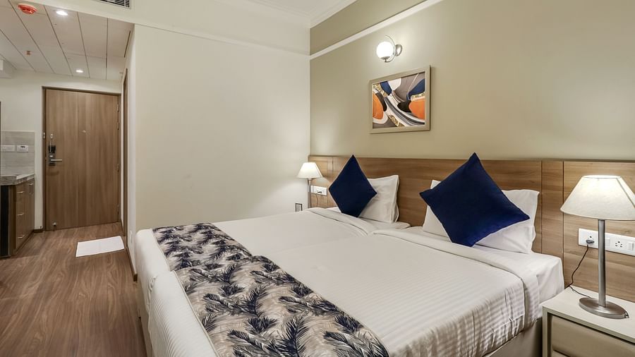 Double bed with side tables inside Premium room - Starlit Suites Newtown, Kolkata