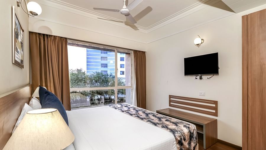 a double bed inside Premium Studio - Starlit Suites Newtown, Kolkata