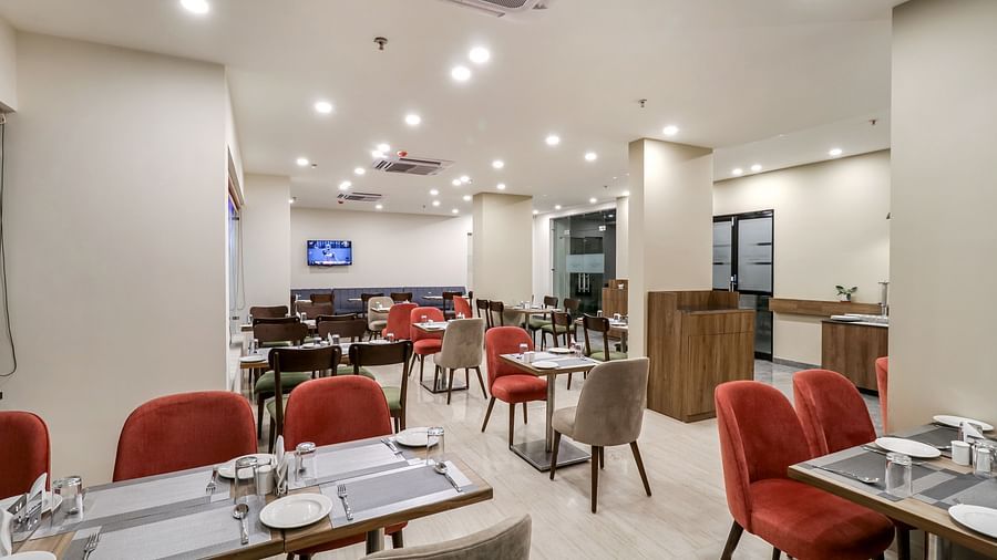 Seating arrangement inside Gourmet 2 - Starlit Suites Newtown, Kolkata
