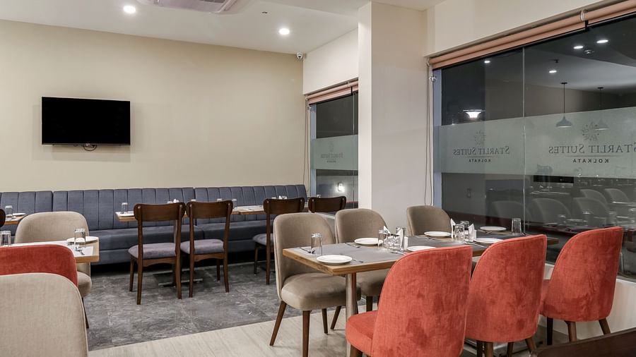 Seating arrangement inside the Restaurant - Starlit Suites Newtown, Kolkata