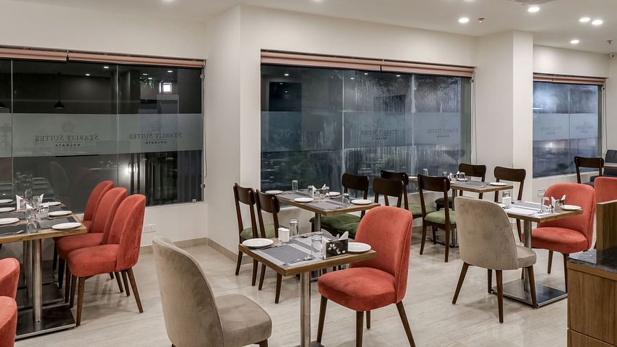 Seating arrangemetn inside Gourmet 3 - Starlit Suites Newtown, Kolkata