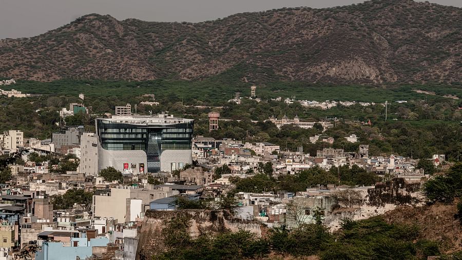 Panoramic cityscape with Sarovar Portico, Ajmer surrounded by lush hills