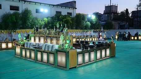 An outdoor buffet set up with decorative lighting in an open event space at Rang Lords Inn Bharuch