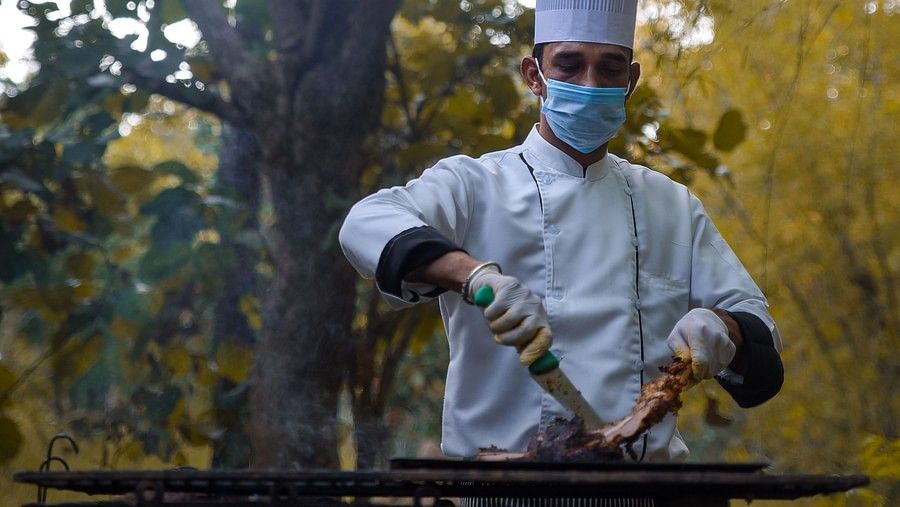 chef cooking outdoors at The Serai Bandipur