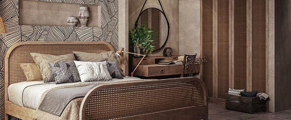A spacious room featuring a large bed and a wall-mounted cupboard to the side at The Evren, Vagator.