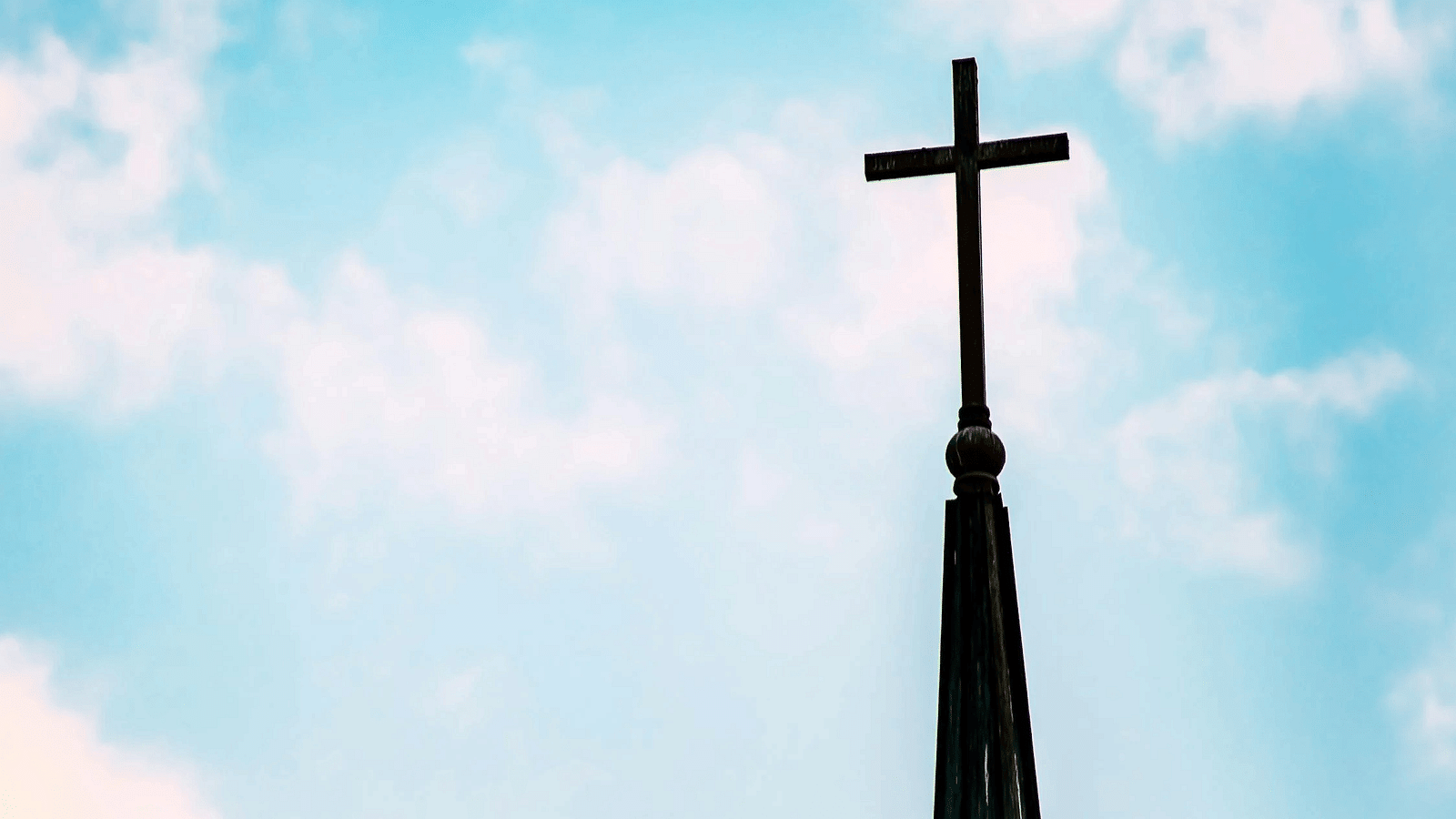 A cross set against a clear background.