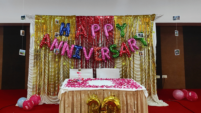 an indoor event venue with anniversary decorations.