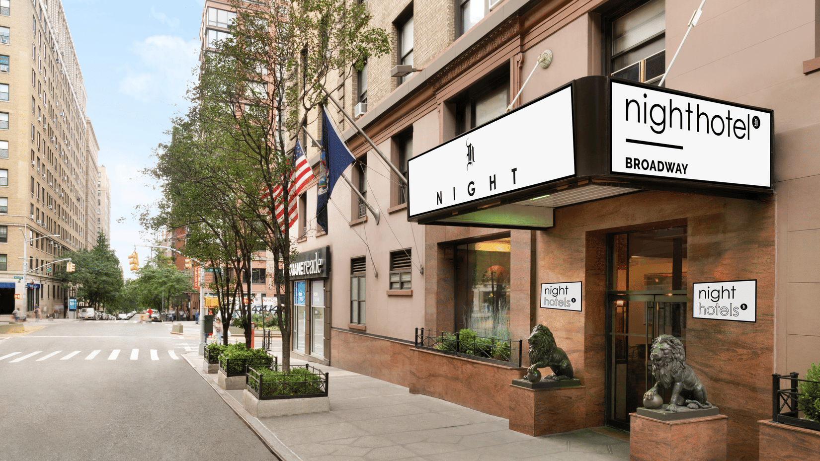 Front exterior of Night Hotel Broadway showing the entrance canopy, clear signage, and the surrounding street view