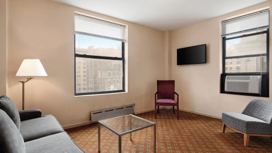 Standard Non Smoking Jr. Suite are spacious and feature a living room with sofas and a table