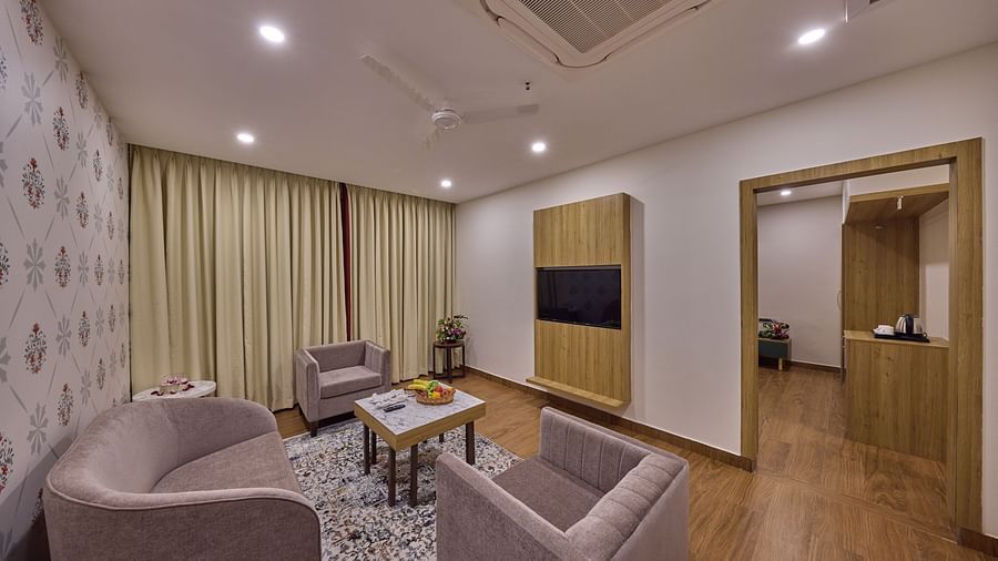  view of the living room offered at the suite decked with sofa sets and a table - Golden Tulip, Tirupati 1