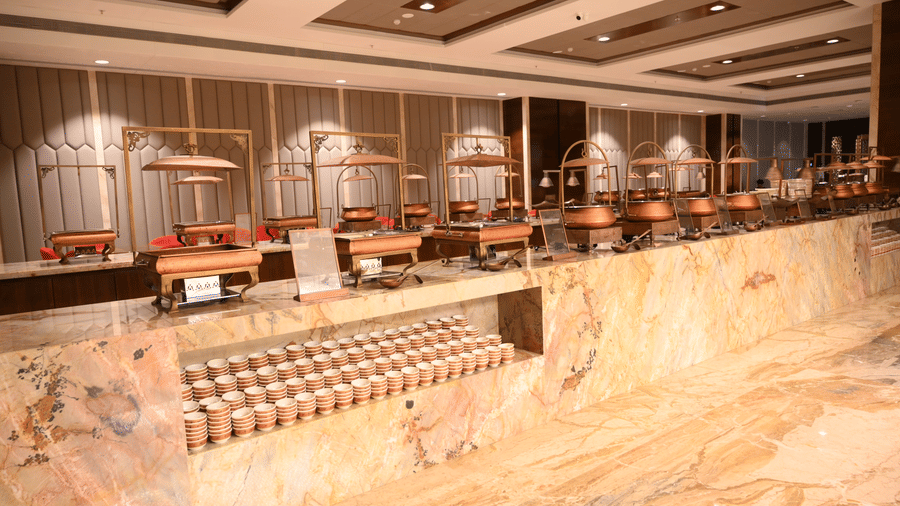 The buffet counter at Lambic banquet hall in Praveg's Grand Eulogia, Ahmedabad is thoughtfully designed to provide a seamless dining experience for event guests.