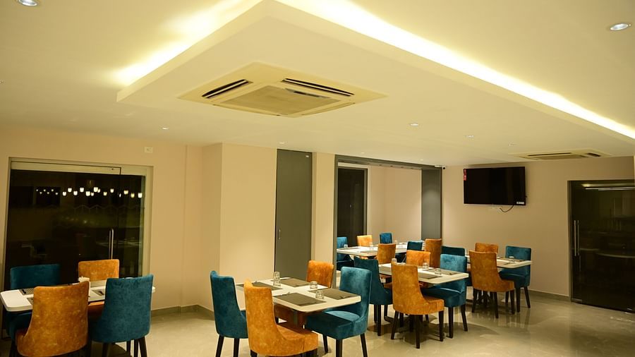 Blue and Yellow coloured chairs at the restaurant at Sterling Keys by TGI in Bnagalore