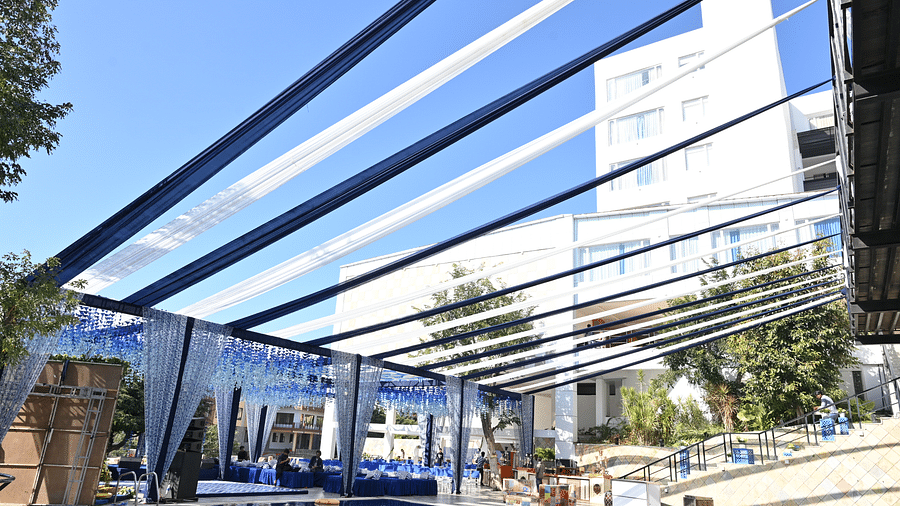 Open-air structure with clear roof and a pool below it - Via Lakhela Resort & Spa