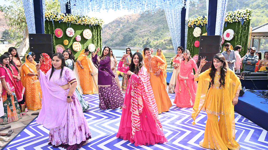 Bridesmaids dancing in colourful dresses - Via Lakhela Resort & Spa