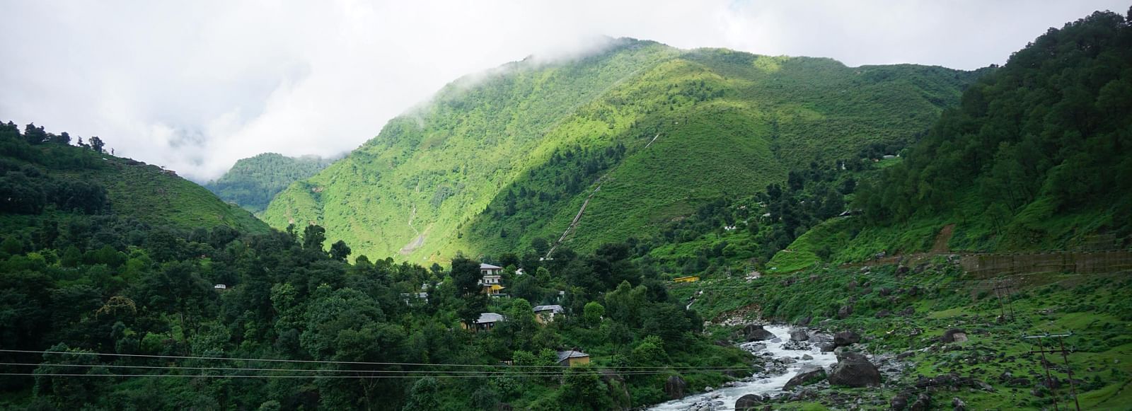 a valley with a stream flowing through it