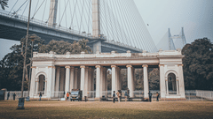 View of Prinsep arch surrounded by green trees next to the Vidyasagar Setu.