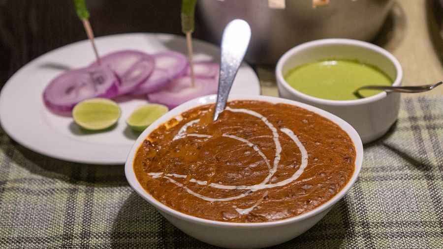 an indian delicacy of dal makhni and butter naan served on a dinner table at a restaurant - Barsana Boutique Hotel Kolkata