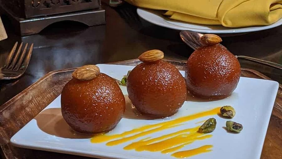 Three gulab jamuns served on a plate | Sun Park Hotel & Banquet, Chandigarh - Zirakpur
