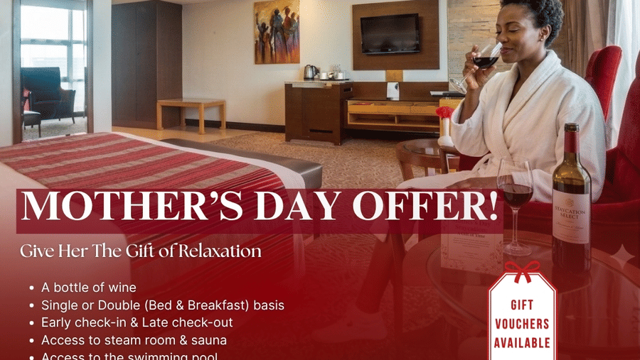 Woman in a robe enjoys a glass of red wine in a hotel room, promoting a Mother Day Offer at The Boma Nairobi. Includes benefits like bed and breakfast, access to amenities, with a price of Ksh 18,000. Valid from May 8 to May 11, 2026.