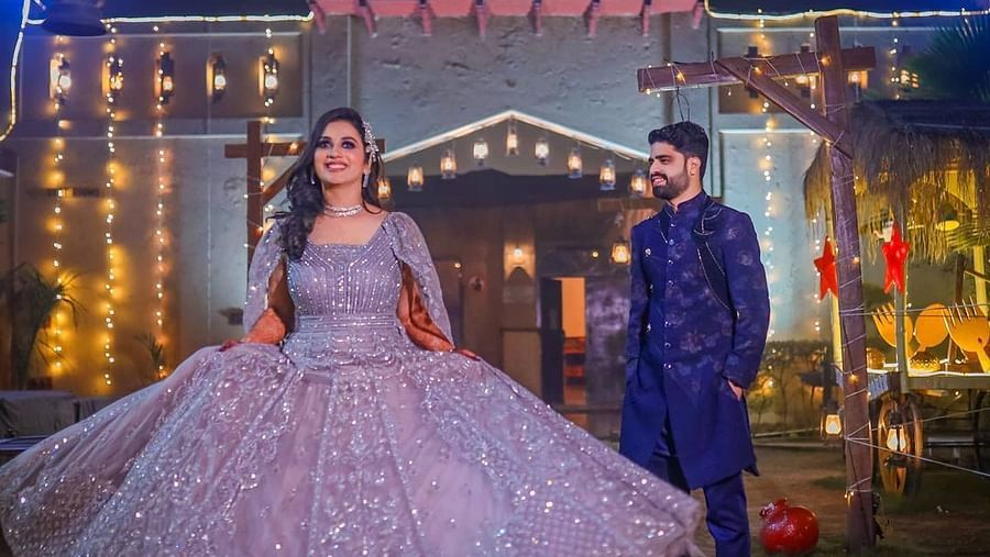 a bride and groom dancing and posing for a pre-wedding shoot at Themis Mudhouse Resorts
