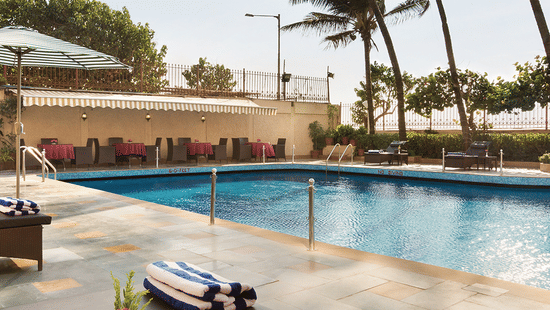 A clear blue swimming pool at the Ramada Plaza by Wyndham Palm Grove. 