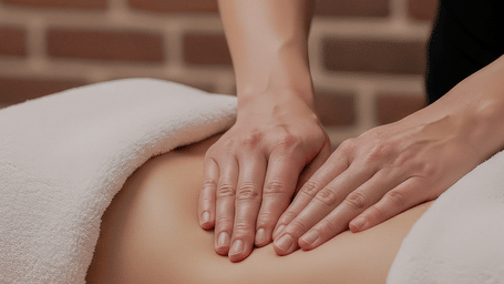 A guest lying comfortably while receiving a soothing professional abdominal body massage treatment at Kavya Himalayas.