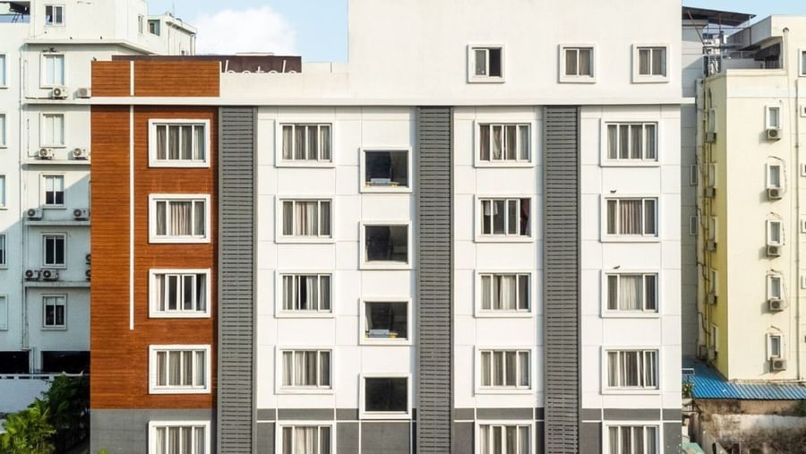 Facade of Destino by Monday Hotels featuring a multi-storey building under a partly cloudy sky.