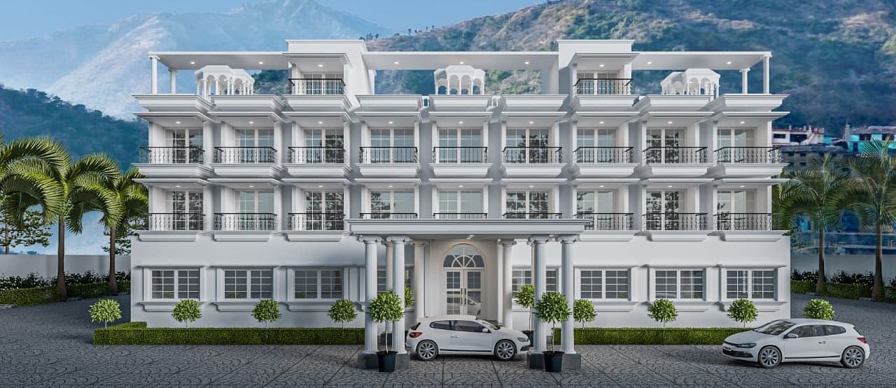 Front view shot of the facade of Namaste Corbett with beautiful mountains in the background.