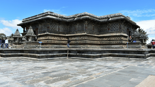 people visiting a temple under clear blue skies