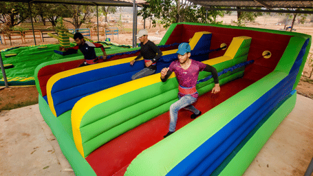 People compete in a fun race on a large colourful inflatable course - District Gravity Adventure Park, Hyderabad