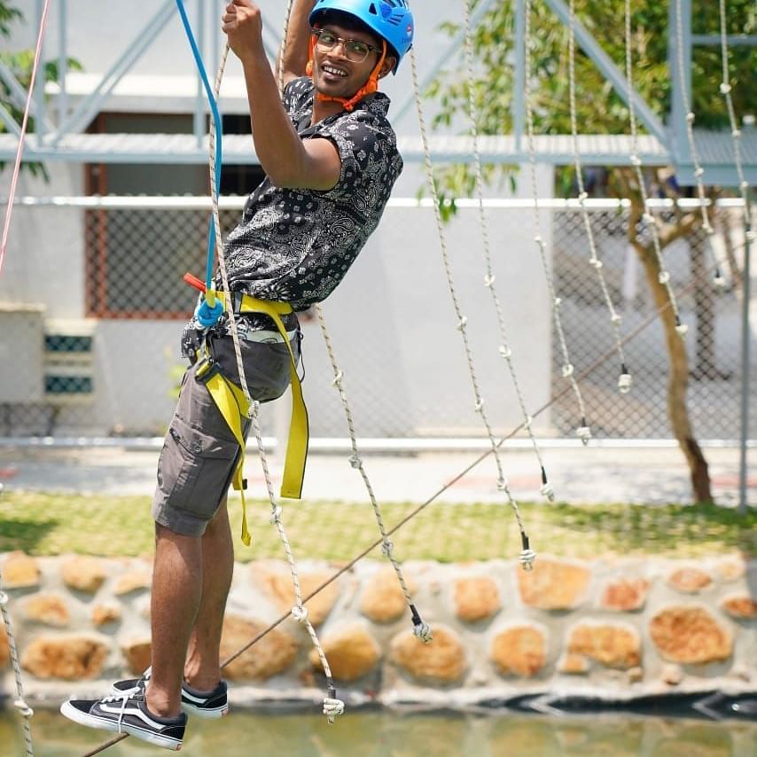 A person on the Chemalien Walk at GK Hill View Resort with intact safety measures.