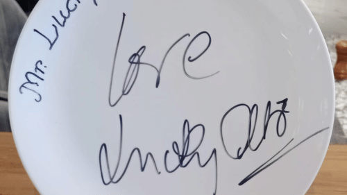 a plate with writing on it