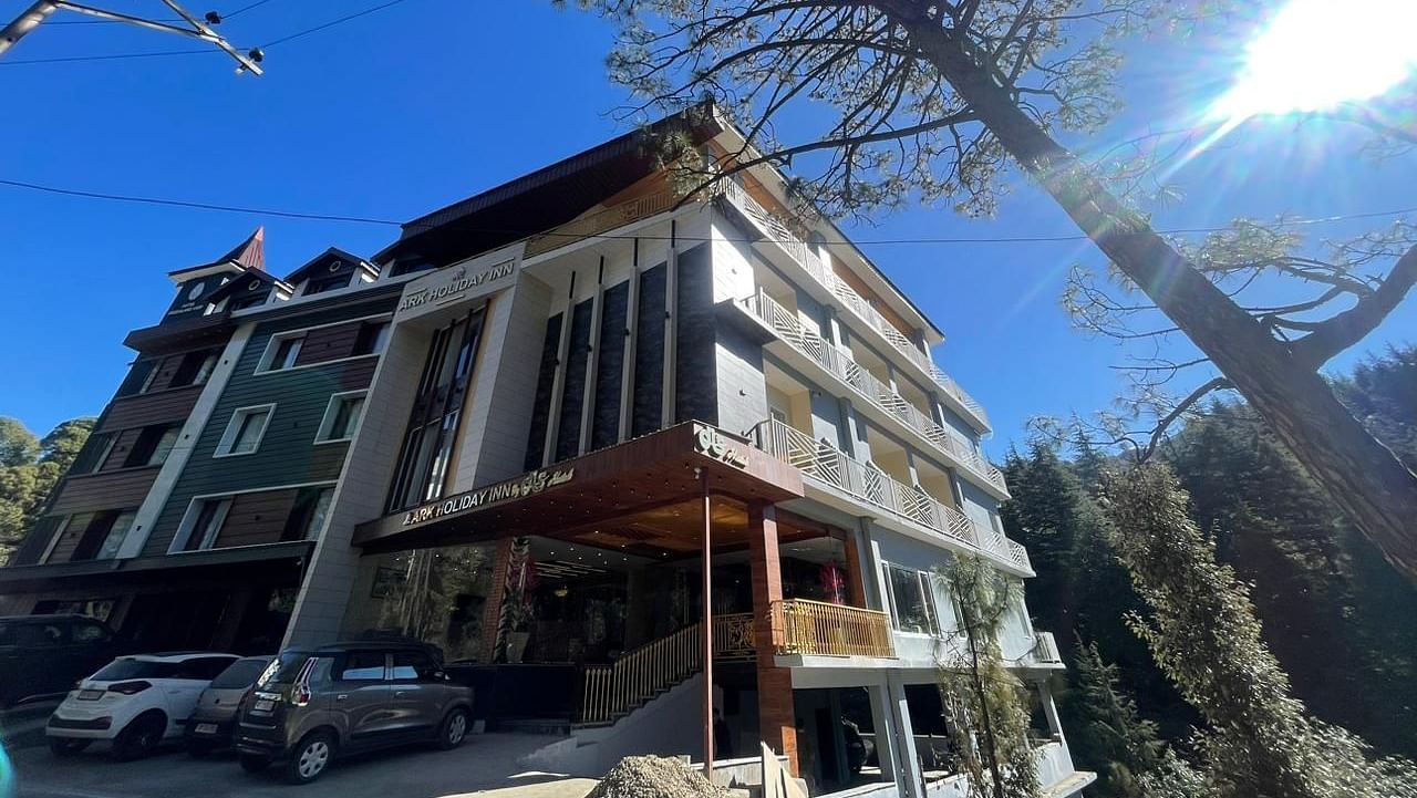 Exterior view of DLS Ark Holiday Inn, Banikhet during the day.