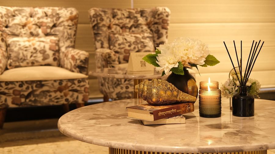 a coffee table and chairs in the lobby at Triptam Hotel, Vrindavan