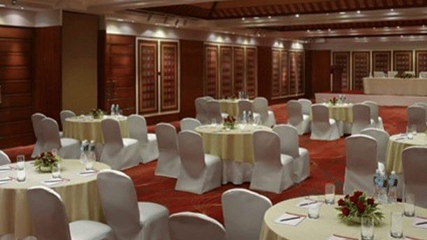 round table seating arrangement inside the banquet hall Event-Garden-Setup at Caravela Beach Resort