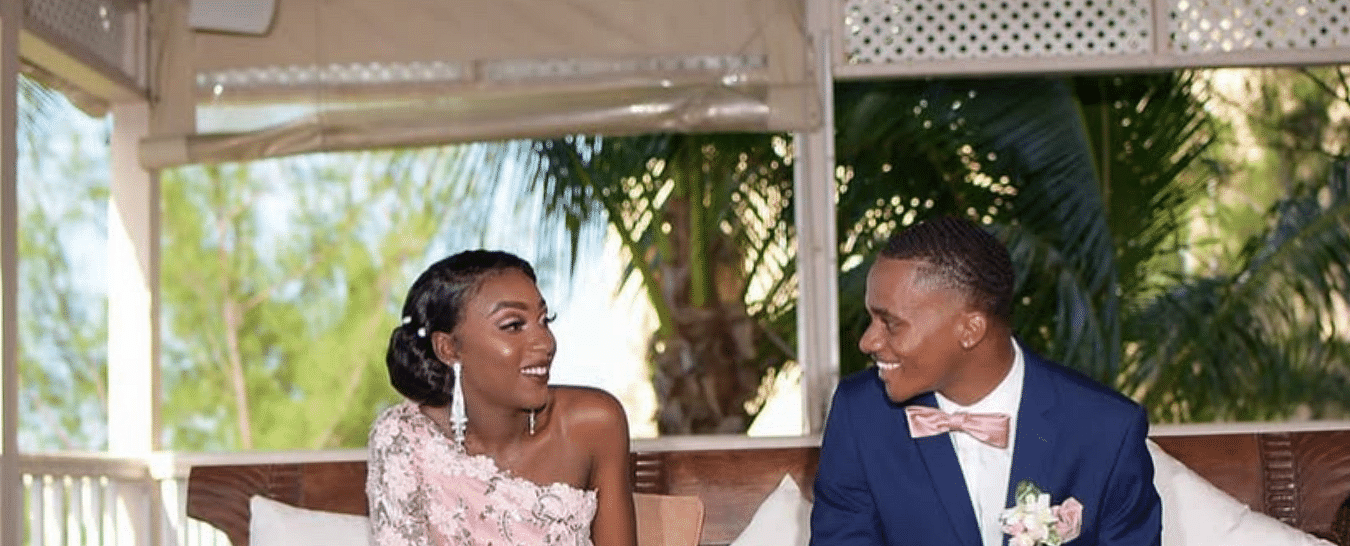 A couple sitting on a bench in a gazebo, both dressed in wedding attire | A Stone's Throw Away