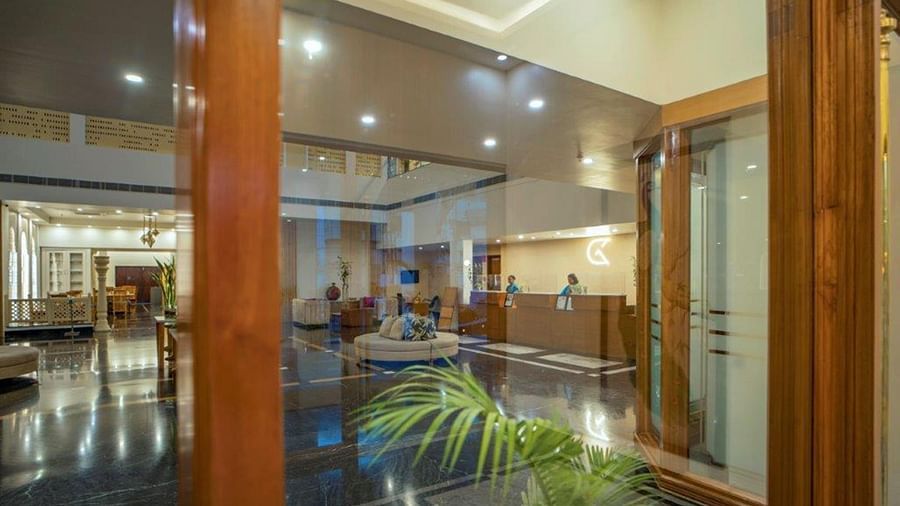 Glass entryway showing interior lounge of Golden Tulip, Udaipur.