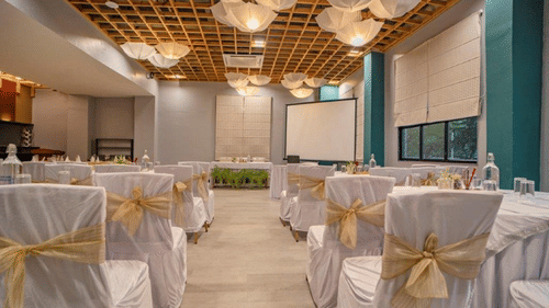 Close-up view of banquet hall seating arrangement at Golden Tulip, Udaipur.