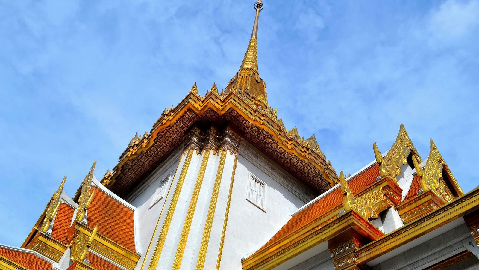 Wat Traimit in view from below with blue sky in the background