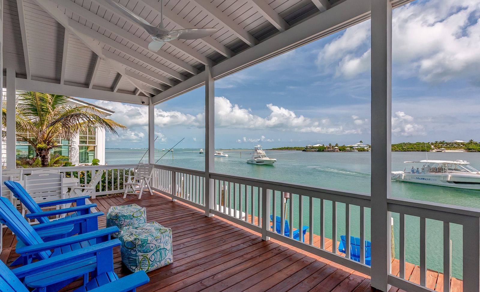 Deck with lounge chairs overlooking the water | Abaco Inn
