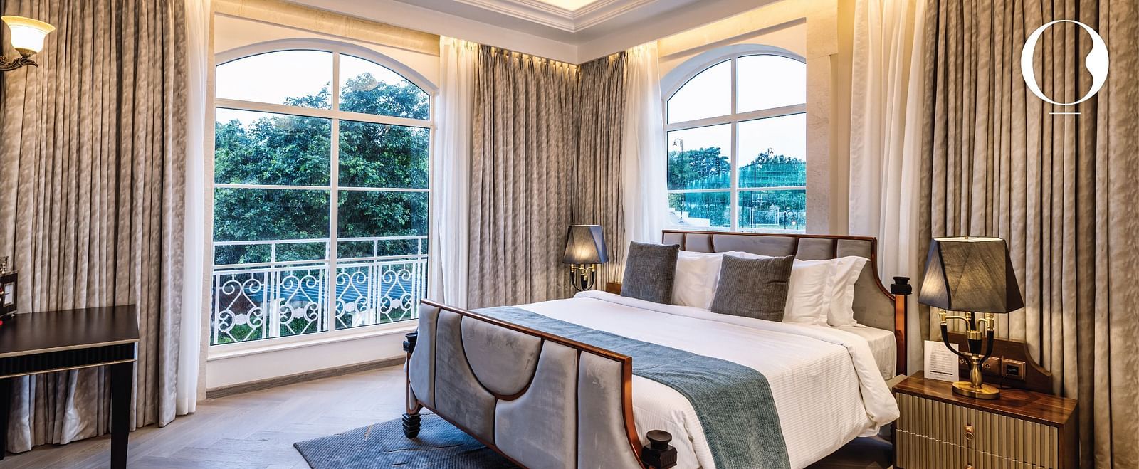 Full view shot of the bedroom of the Suite with ample natural light coming from the windows at Miros Hotels.