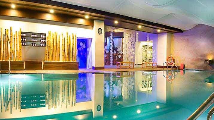 Swimming pool alongside the room at  Grand Chennai By GRT Hotels.