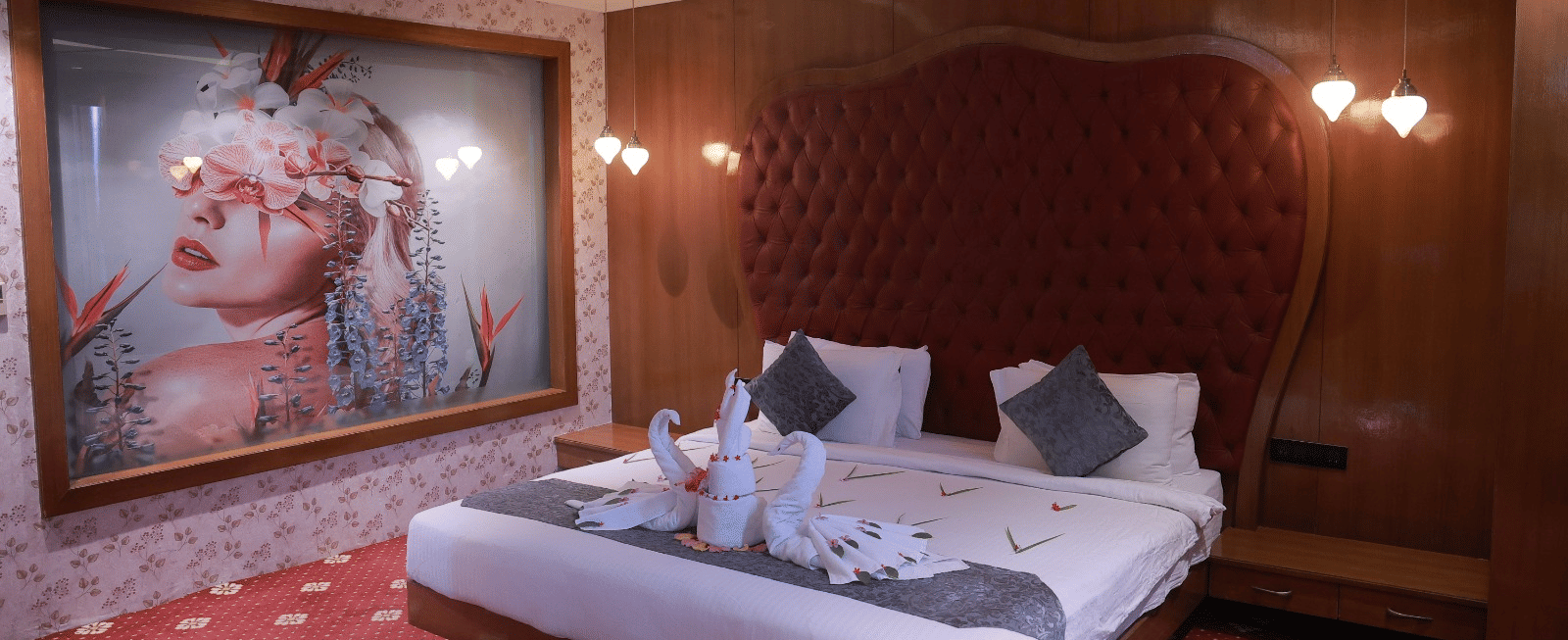 Gallery, King bed beneath the portrait artwork