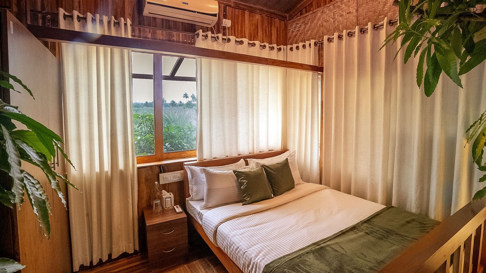Image of a bedroom with a window and bed