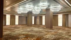 A grand banquet hall with high ceilings featuring chandeliers - Serene Sarovar Premiere Hargeisa