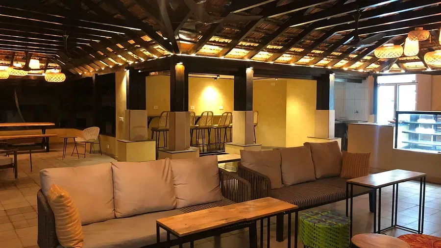 A communal space with seating area at Indie Stays Resort, Goa