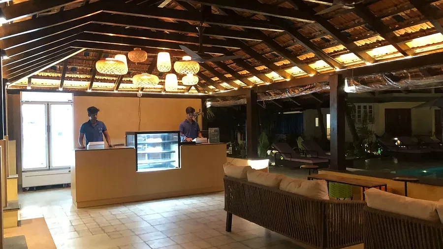 A communal space with a counter and a seating capacity at Indie Stays Resort, Goa.