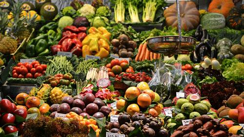 Various kinds of fruits and vegetables kept on display at a market