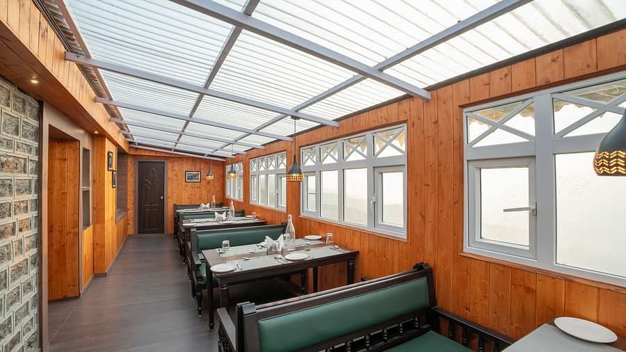 Seating arrangement in the restaurant at Poshtel, Meghma