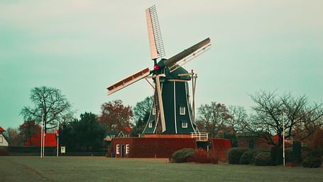  An image of the windmill among the forest area.